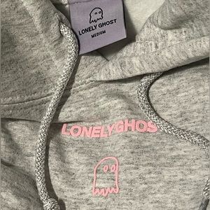 gray and pink “text me when you get home” lonely ghost sweatshirt